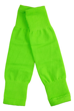 Pair of bright neon green footless soccer socks isolated on white background. Athletic leg sleeves for shin guards studio shot