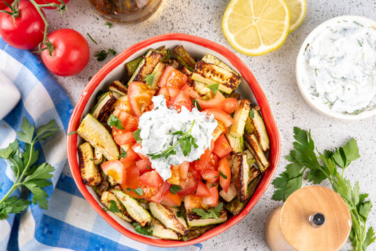 Hot zucchini tomato yogurt salad