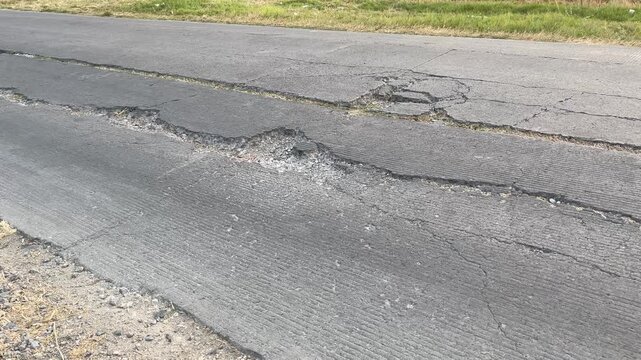 Long Longitudinal Cracks on Asphalt Road Surface