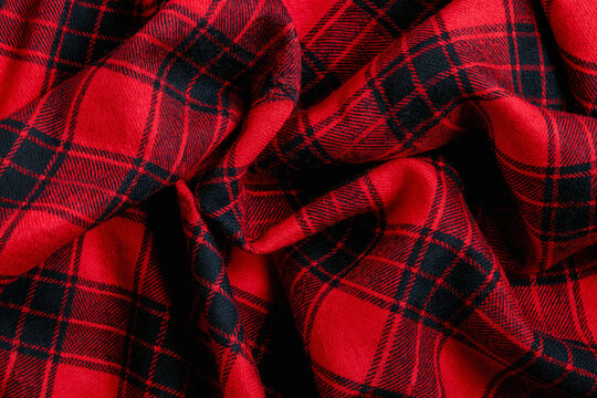 Soft red and black plaid flannel cloth texture close up