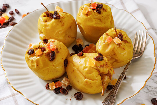 Freshly baked green apples with cinnamon, raisins
