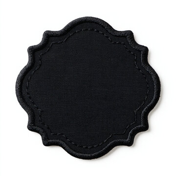 Black embroidered patch isolated on white background. Customizable fabric emblem for apparel or branding projects.