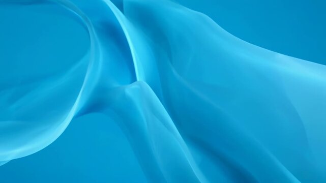 Abstract blue fabric flowing gracefully in soft studio lighting with gentle undulations