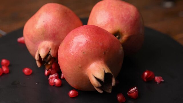 Slow Rotating Ripe Anar Fruits Showing Natural Texture and Crown Details