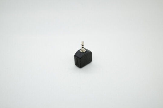 A black 3.5mm Audio splitter isolated on white background