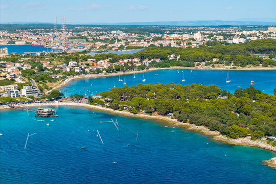 Drone aerial view of Pula harbor and Adriatic coastline in Croatia