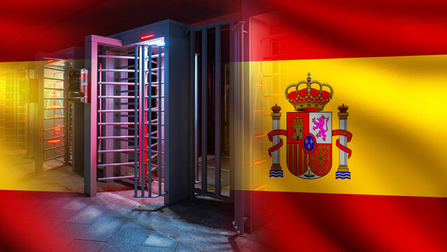 Border security. Spanish flag overlays automated turnstiles representing immigration control, restricted access, border checkpoints and national security.
