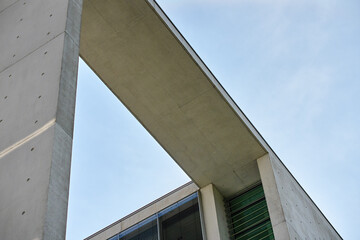 Fototapeta premium Modern concrete building detail against blue sky