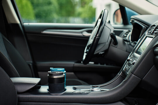 Reusable coffee cups in car cup holders