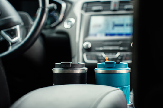 Reusable coffee cups in car cup holders