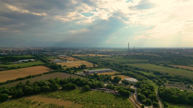 Aerial View of Farmland and Industrial Landscape near Plovdiv with Dramatic Sun Rays, Bulgaria