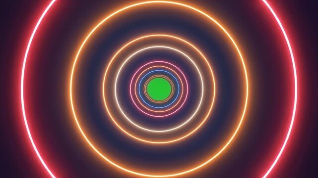 Pulsing neon concentric circles in motion with a green center during a dark digital tunnel effect