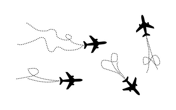 A high angle aerial perspective shows several passenger airplanes in coordinated flight creating an interesting visual pattern on a plain white sky backdrop