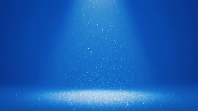 Blue dust particles illuminated by spotlights moving gently across a dark stage during a dramatic cinematic sequence