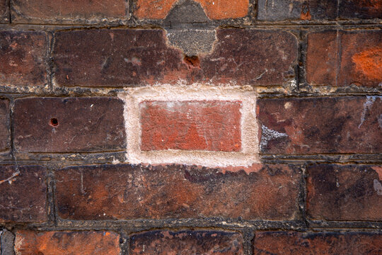 Replaced Brick in a Wall