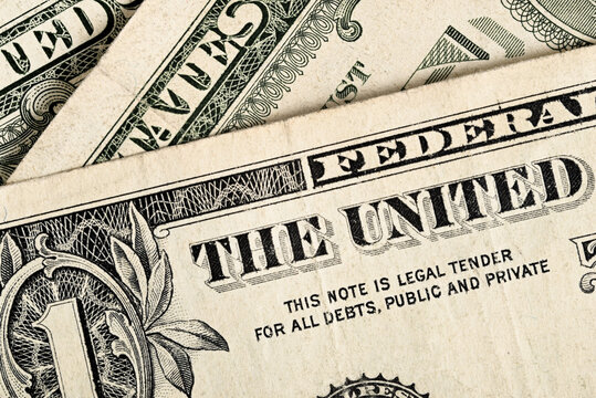 One dollar bill close-up. Detail of old US currency with legal tender text and engraved banknote elements.