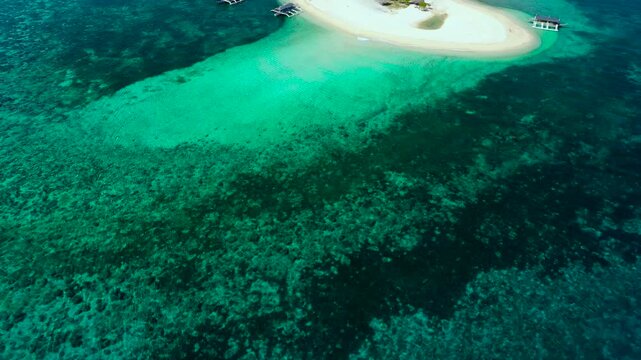 Summer beach landscape. Tropical island view, palm trees with amazing blue sea. Digyo Island, Philippines. Island with a tropical beach and turquoise lagoons.