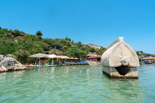 Turquoise waters and ancient Lycian coast of Kekova Island during a boat cruise in Antalya, Turkey.