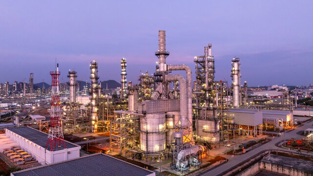 Oil and gas refinery plant at twilight, Global business power and energy petrochemical industry, Oil and gas refinery petrochemical industrial.