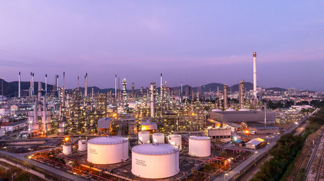 Oil and gas refinery plant at twilight, Global business power and energy petrochemical industry, Oil and gas refinery petrochemical industrial.