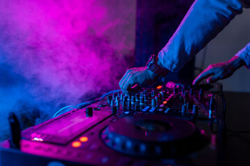 Fototapeta na wymiar DJ mixing vibrant nightclub beats