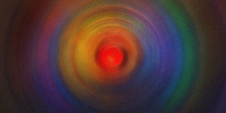Abstract red light tunnel effect with circular motion blur on colorful dark background.