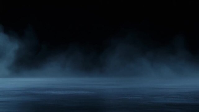 Deep indigo fog rolls slowly across dark reflective surface, gentle billows continuously shifting under cool backlighting with moody serene atmosphere, soft glow, and cinematic depth.