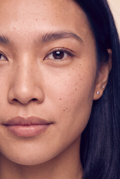 Closeup portrait of asian woman skin texture and freckles for skincare poster and facial care background for product design
