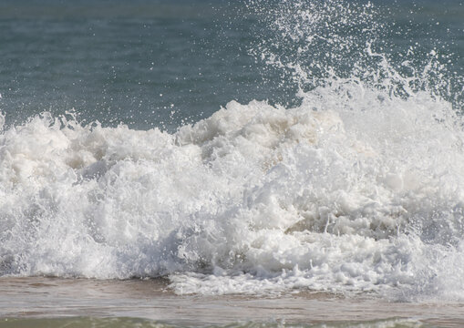 The ocean is rough and the waves are high