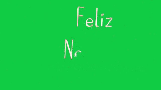 Glowing orb moving, depositing granules, drawing Feliz Navidad with heart line on transparent field