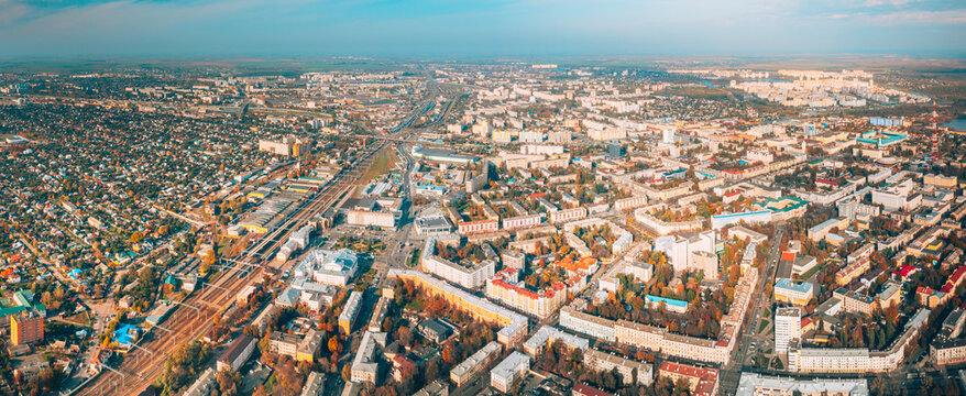 Aerial view of Homiel cityscape in autumn day. Bird's-eye view of railway station building and residential district. Gomel, Belarus. Panorama, panoramic view