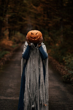 Spooky and scary Halloween themed image in a dark forest. 