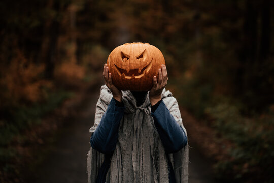 Spooky and scary Halloween themed image in a dark forest. 