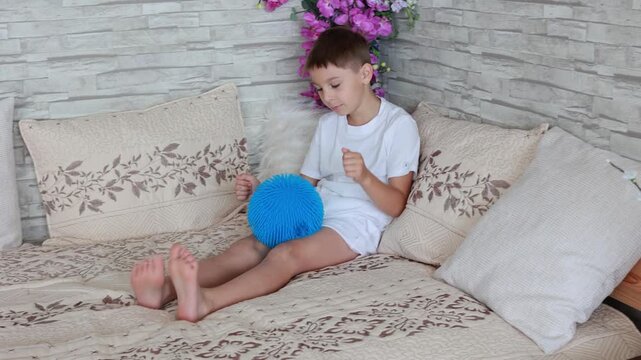 Cute preschool child, boy, playing with toys in a sunny living room
