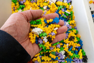Fototapeta premium Hjorring, Denmark A handful of miniature Legos in a box.