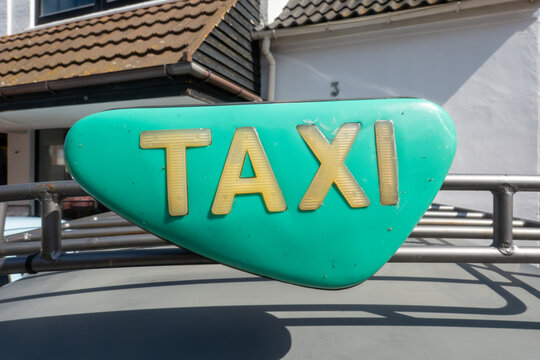 Hirthals, Denmark Old classic and vintage cars at the annual Hirtshals veteran car show, and a vintage sign on a taxi.