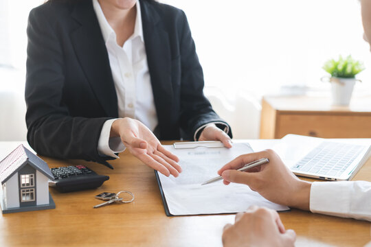 Real estate, banker present house model with client before tenant sign contract rental purchase buyer home with landlord, realtor after agreement mortgage success done. Property lease agent concept.