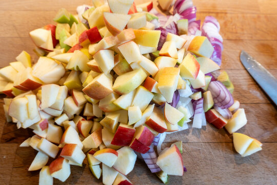 Hirthsals, Denmark A pile of chopped apples and onions on a kitchen counter.