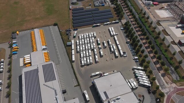 Aerial view of bus depot parking lot and logistics center