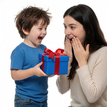 Young boy gives surprised woman blue gift box with red ribbon. Happy child presents birthday present to mother. Joyful family moment of celebration, love on white background. Excited woman reacts