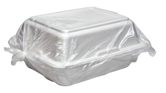 A white styrofoam takeout container with a lid on transparent background
