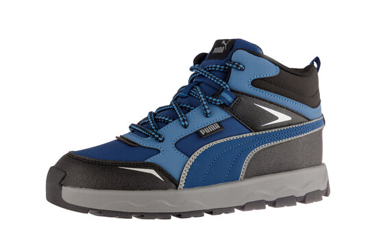 Varna , Bulgaria - November 11, 2025 :Puma Kids Blue Water-Repellent High-Top Sneakers, Durable Outdoor Winter Boots for Children, Isolated on White Background