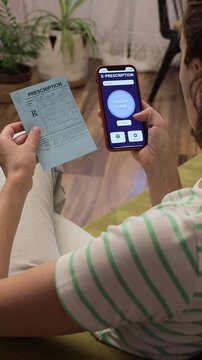 Woman holding paper prescription from doctor and using mobile phone, app to order, buy medicine. Closeup view. Process of buying medicine remotely through a smartphone app