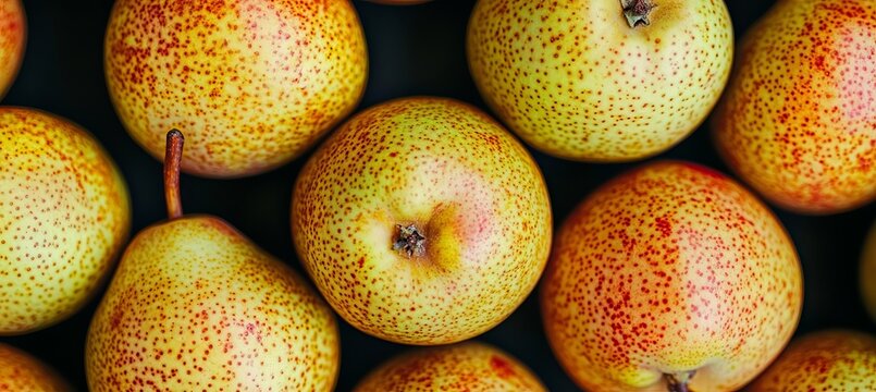 A Close Up Top View Of Juicy Summer Pears With Russet Dots Filling The Entire Frame Background.