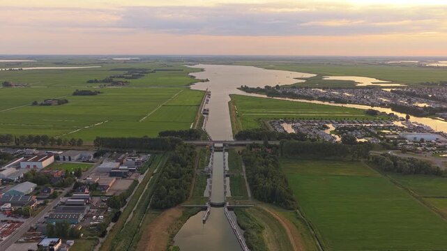 Aerial view of a cargo ship passing through the princess margriet lock in lemmer