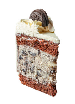 Layered chocolate cake slice with cream frosting and cookie topping, showcasing rich textures and contrasting colors against a white background