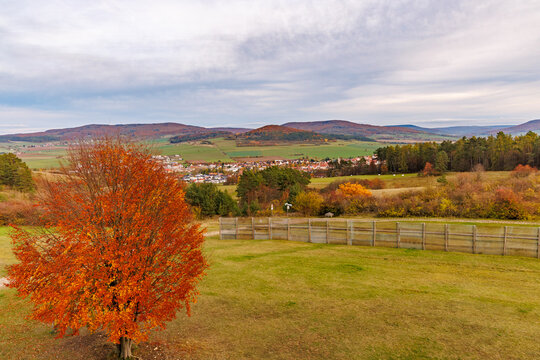 Autumn landscape at the former inner German border near Fulda, featuring an original border fence, the Green Belt, and the historic Kolonnenweg patrol road