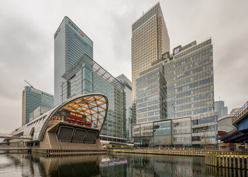 Crossrail Place and Canary Wharf skyscrapers reflected across North Dock in London