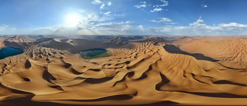 Turquoise Oasis Lake Surrounded by Golden Sand Dunes in Badain Jaran Desert, China