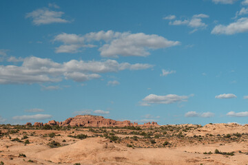 Clouds drift above the rocky desert at Arches National Park, Utah © LB Photo Co